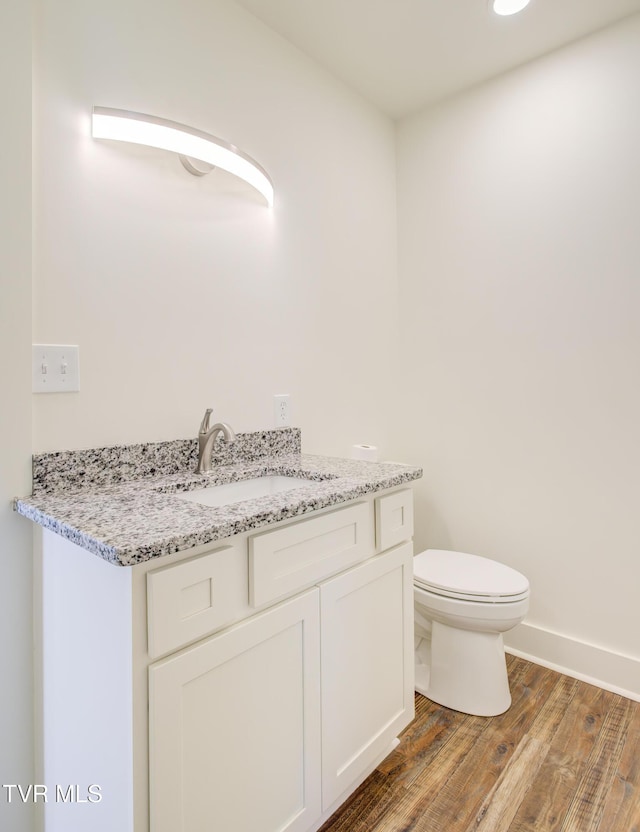 408 Levelin St, Erwin, TN 37650 - bathroom with vanity, wood finished floors, toilet, and baseboards