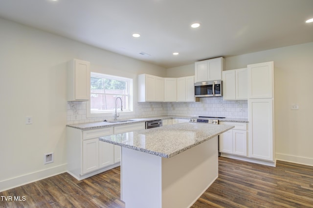 408 Levelin St, Erwin, TN 37650 - kitchen featuring stainless steel appliances, a sink, dark wood finished floors, white cabinets, and recessed lighting