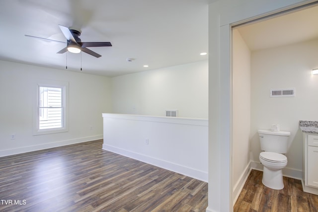 408 Levelin St, Erwin, TN 37650 - empty room with dark wood finished floors, ceiling fan, recessed lighting, and baseboards