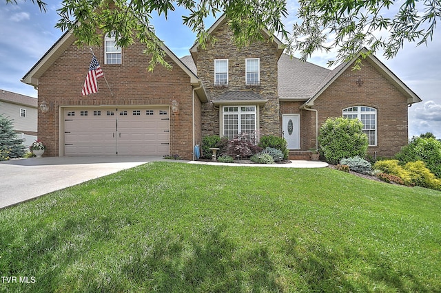 410 Grovemont Pl, Piney Flats, TN 37686 - traditional-style house with driveway, stone siding, a front lawn, and brick siding