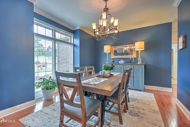 410 Grovemont Pl, Piney Flats, TN 37686 - dining room featuring crown molding, a chandelier, baseboards, and wood finished floors