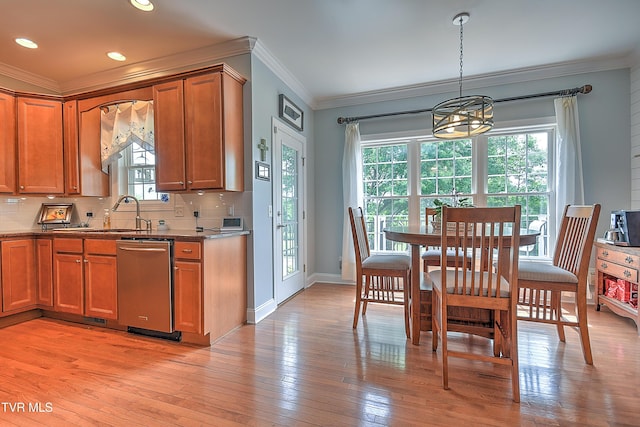410 Grovemont Pl, Piney Flats, TN 37686 - kitchen with stainless steel dishwasher, a sink, brown cabinetry, light wood-style flooring, and ornamental molding