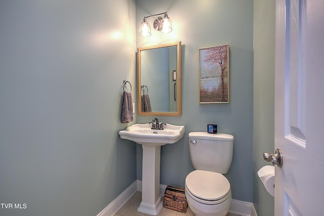 410 Grovemont Pl, Piney Flats, TN 37686 - half bathroom with baseboards, toilet, tile patterned floors, and a sink