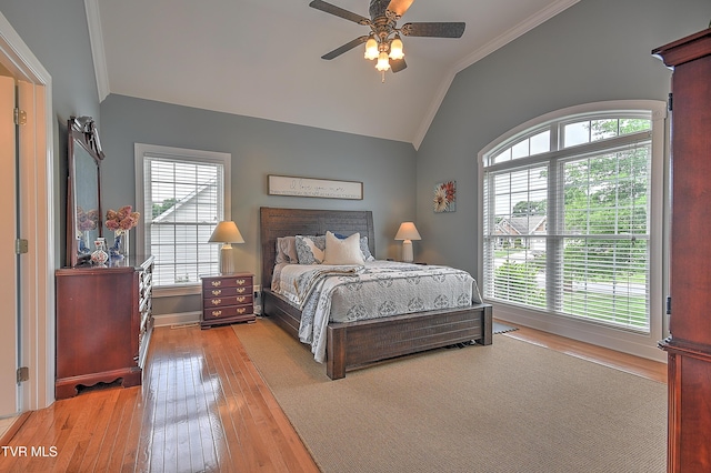 410 Grovemont Pl, Piney Flats, TN 37686 - bedroom featuring ornamental molding, vaulted ceiling, light wood-style flooring, multiple windows, and baseboards