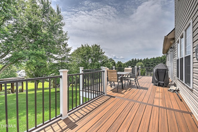 410 Grovemont Pl, Piney Flats, TN 37686 - deck with outdoor dining space, area for grilling, and a yard