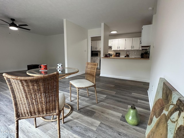 516 Fleetwood Ct Unit F, Kingsport, TN 37660 - dining area featuring dark wood finished floors, a ceiling fan, and baseboards