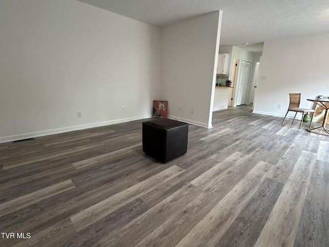 516 Fleetwood Ct Unit F, Kingsport, TN 37660 - unfurnished living room with dark wood finished floors and baseboards