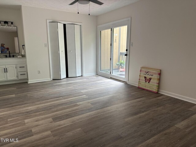 516 Fleetwood Ct Unit F, Kingsport, TN 37660 - unfurnished bedroom featuring access to exterior, a textured ceiling, wood finished floors, baseboards, and a closet