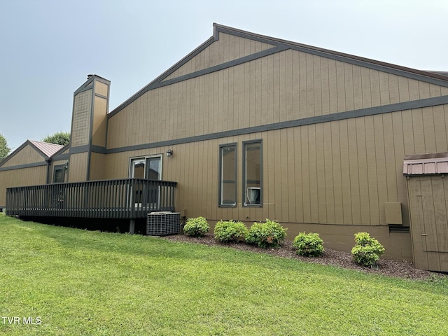 516 Fleetwood Ct Unit F, Kingsport, TN 37660 - rear view of property with a deck, a lawn, a chimney, and central AC