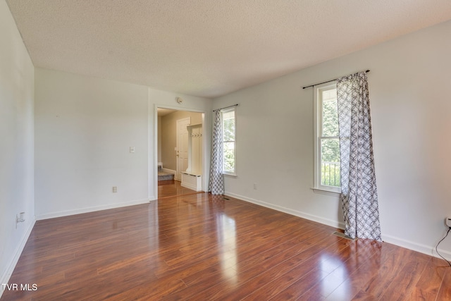 219 Meridale Dr, Johnson City, TN 37601 - unfurnished room featuring wood finished floors, a textured ceiling, and baseboards