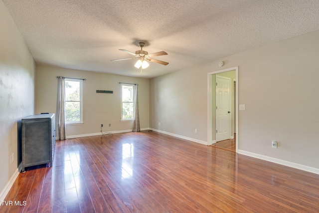 219 Meridale Dr, Johnson City, TN 37601 - unfurnished living room with a ceiling fan, wood finished floors, a textured ceiling, and baseboards