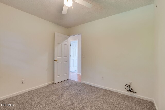 219 Meridale Dr, Johnson City, TN 37601 - carpeted empty room featuring baseboards, a ceiling fan, and a textured ceiling