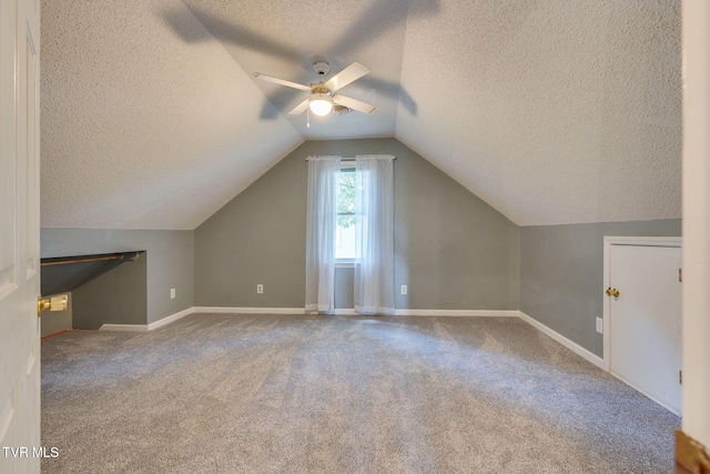 219 Meridale Dr, Johnson City, TN 37601 - bonus room featuring a textured ceiling, carpet flooring, ceiling fan, lofted ceiling, and baseboards