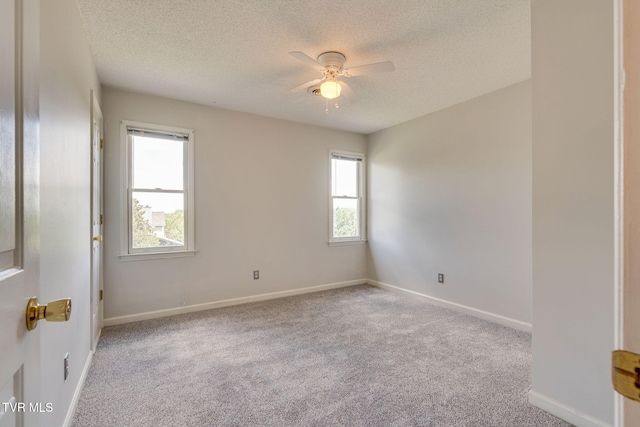 219 Meridale Dr, Johnson City, TN 37601 - unfurnished room featuring a textured ceiling, a ceiling fan, carpet flooring, and baseboards