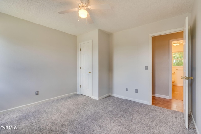 219 Meridale Dr, Johnson City, TN 37601 - unfurnished bedroom with carpet floors, baseboards, a textured ceiling, and ceiling fan