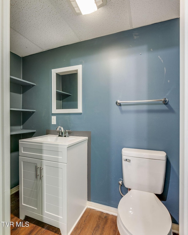 219 Meridale Dr, Johnson City, TN 37601 - bathroom with a paneled ceiling, vanity, toilet, wood finished floors, and baseboards