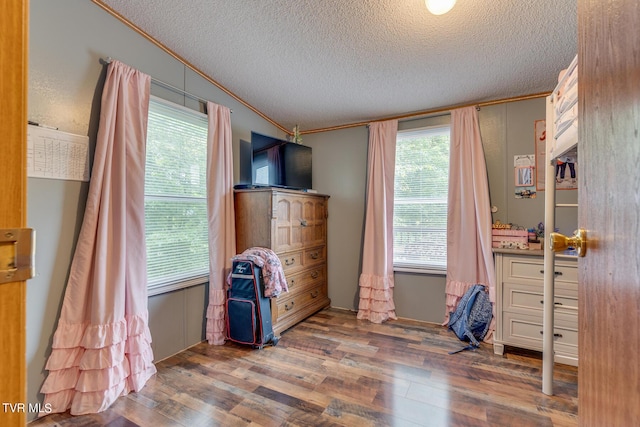 6855 Gate City Hwy, Bristol, VA 24202 - bedroom with crown molding, multiple windows, wood finished floors, and a textured ceiling