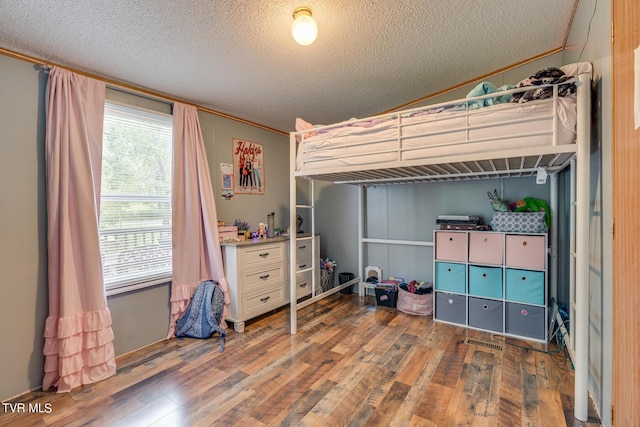 6855 Gate City Hwy, Bristol, VA 24202 - bedroom with wood finished floors, a textured ceiling, and crown molding