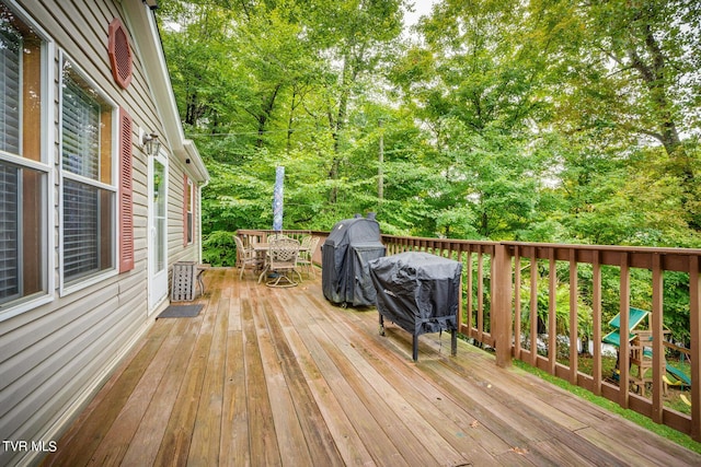 6855 Gate City Hwy, Bristol, VA 24202 - wooden terrace featuring grilling area, outdoor dining space, and view of scattered trees