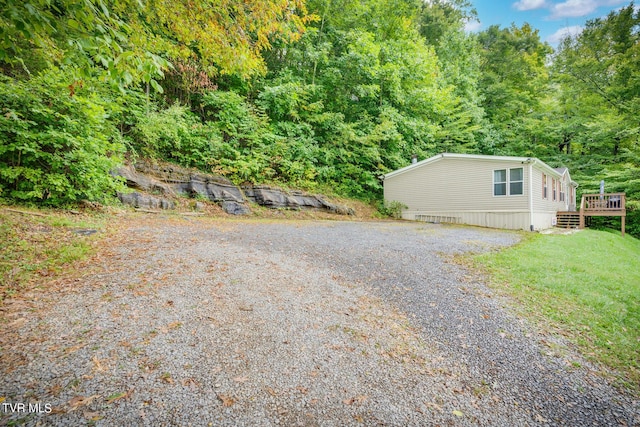 6855 Gate City Hwy, Bristol, VA 24202 - view of front of home with a wooden deck, driveway, and a wooded view
