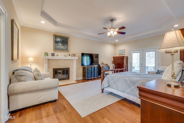 2001 Springfield Ave, Kingsport, TN 37664 - bedroom featuring a raised ceiling, access to exterior, light wood finished floors, ornamental molding, and a fireplace with flush hearth