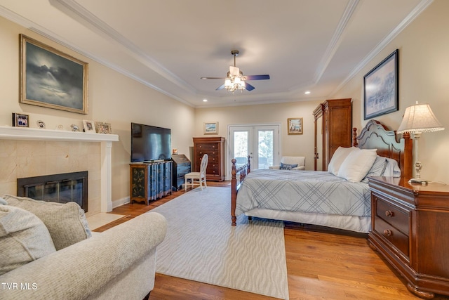 2001 Springfield Ave, Kingsport, TN 37664 - bedroom featuring access to exterior, french doors, wood finished floors, a tiled fireplace, and a tray ceiling