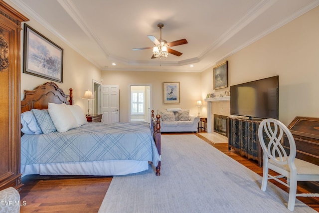 2001 Springfield Ave, Kingsport, TN 37664 - bedroom with wood finished floors, a raised ceiling, ornamental molding, and a fireplace with flush hearth