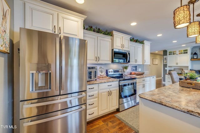110 Emmanuel Dr, Johnson City, TN 37601 - kitchen featuring stainless steel appliances, dark wood-style flooring, recessed lighting, decorative light fixtures, and light stone counters