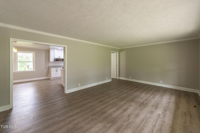 1236 Nassau Dr, Kingsport, TN 37660 - unfurnished room featuring dark wood-type flooring, baseboards, crown molding, and a textured ceiling