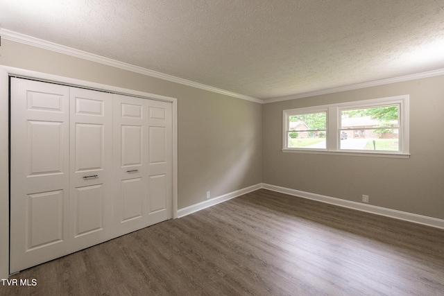 1236 Nassau Dr, Kingsport, TN 37660 - unfurnished bedroom with a textured ceiling, dark wood-style floors, baseboards, a closet, and ornamental molding