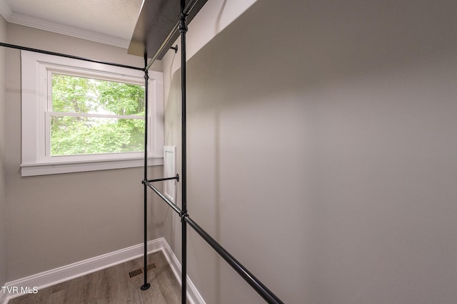 1236 Nassau Dr, Kingsport, TN 37660 - detailed view of wood finished floors, crown molding, baseboards, and a textured ceiling
