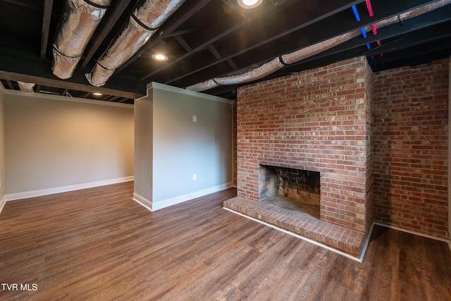 1236 Nassau Dr, Kingsport, TN 37660 - finished below grade area with baseboards, wood finished floors, and a brick fireplace