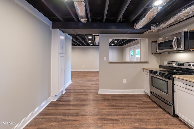 1236 Nassau Dr, Kingsport, TN 37660 - kitchen with appliances with stainless steel finishes, dark wood-style flooring, white cabinetry, and baseboards