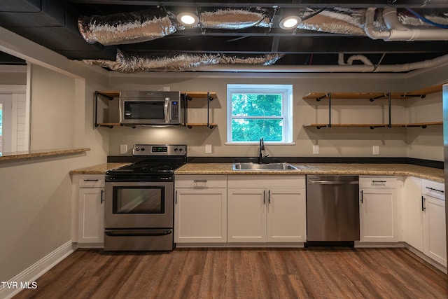 1236 Nassau Dr, Kingsport, TN 37660 - kitchen with stainless steel appliances, a sink, dark wood finished floors, white cabinets, and baseboards