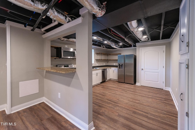 1236 Nassau Dr, Kingsport, TN 37660 - finished below grade area featuring stainless steel fridge, dark wood-style flooring, and baseboards