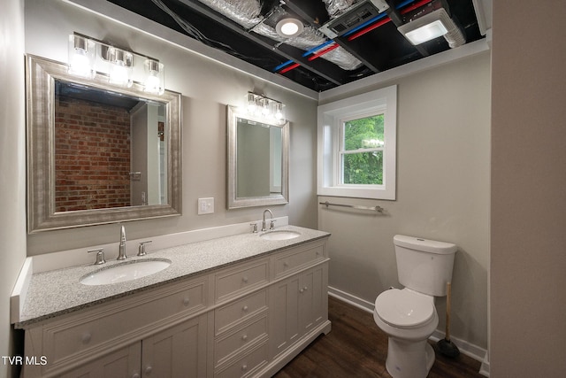 1236 Nassau Dr, Kingsport, TN 37660 - full bath with wood finished floors, double vanity, toilet, and baseboards