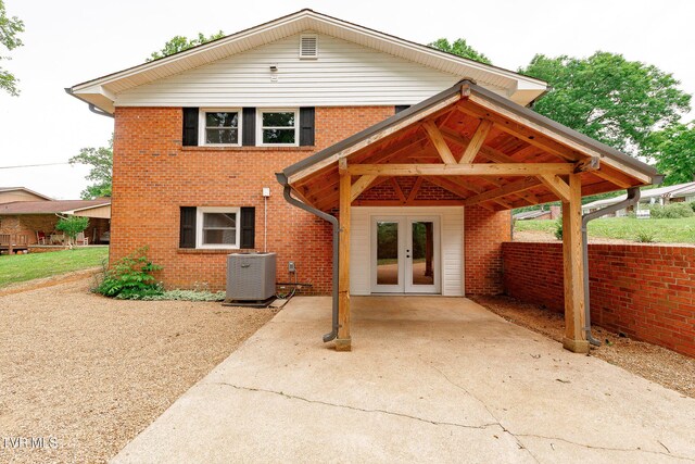 1236 Nassau Dr, Kingsport, TN 37660 - view of front facade with central AC unit, french doors, and brick siding