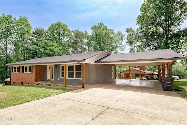 1236 Nassau Dr, Kingsport, TN 37660 - ranch-style house with driveway, a carport, a front lawn, and a porch