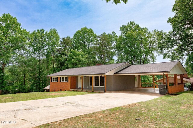 1236 Nassau Dr, Kingsport, TN 37660 - single story home featuring a carport, concrete driveway, and a front yard