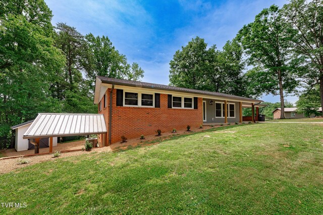 1236 Nassau Dr, Kingsport, TN 37660 - single story home featuring a front yard, brick siding, and a carport