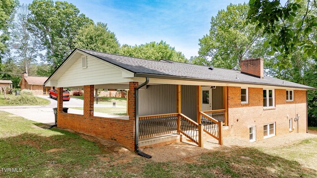1236 Nassau Dr, Kingsport, TN 37660 - view of side of property featuring a chimney, brick siding, and a shingled roof