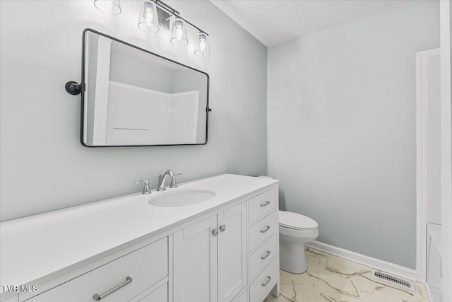 2700 Indian Ridge Rd Unit 12, Johnson City, TN 37604 - bathroom featuring marble look tile flooring, vanity, toilet, a textured ceiling, and baseboards