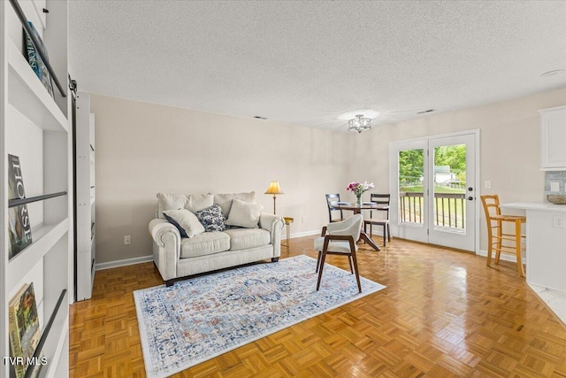 2700 Indian Ridge Rd Unit 12, Johnson City, TN 37604 - living area featuring a textured ceiling, baseboards, and a barn door