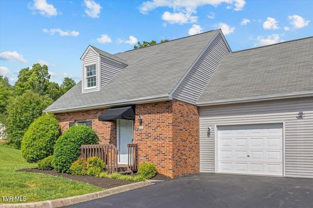 2700 Indian Ridge Rd Unit 12, Johnson City, TN 37604 - cape cod home with brick siding, a garage, a shingled roof, and driveway