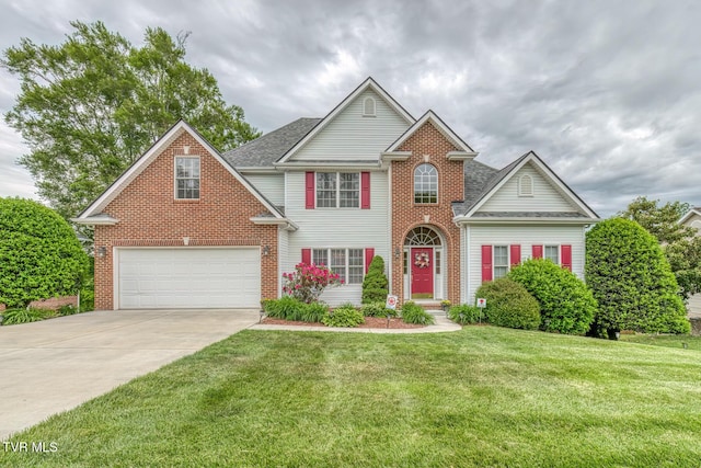 220 Michaels Ridge Blvd, Johnson City, TN 37615 - view of front of house with brick siding, concrete driveway, a front yard, and roof with shingles