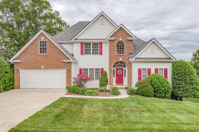 220 Michaels Ridge Blvd, Johnson City, TN 37615 - view of front of property featuring brick siding, a front yard, concrete driveway, and roof with shingles