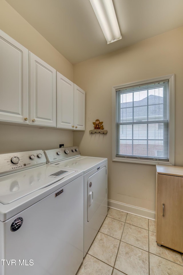 220 Michaels Ridge Blvd, Johnson City, TN 37615 - laundry area featuring cabinet space, separate washer and dryer, light tile patterned flooring, and baseboards