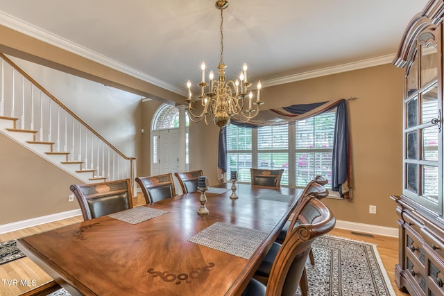 220 Michaels Ridge Blvd, Johnson City, TN 37615 - dining room featuring a chandelier, light wood-type flooring, baseboards, crown molding, and stairs