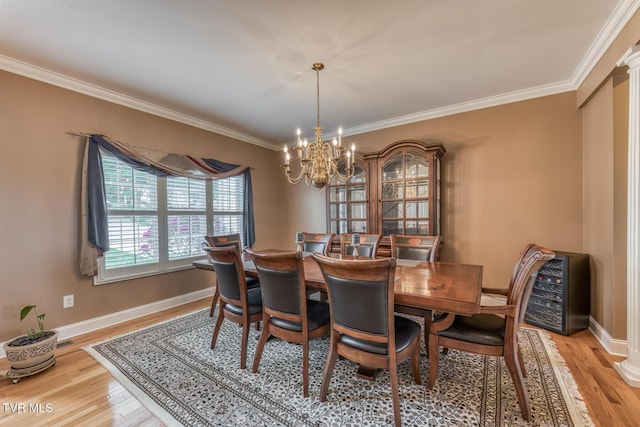 220 Michaels Ridge Blvd, Johnson City, TN 37615 - dining area with a chandelier, light wood-type flooring, crown molding, and baseboards
