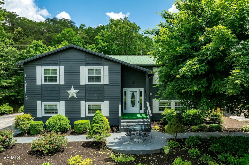 524 Mountain View Dr, Piney Flats, TN 37686 - view of front of home with metal roof and a standing seam roof